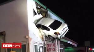 Car Crashes into building